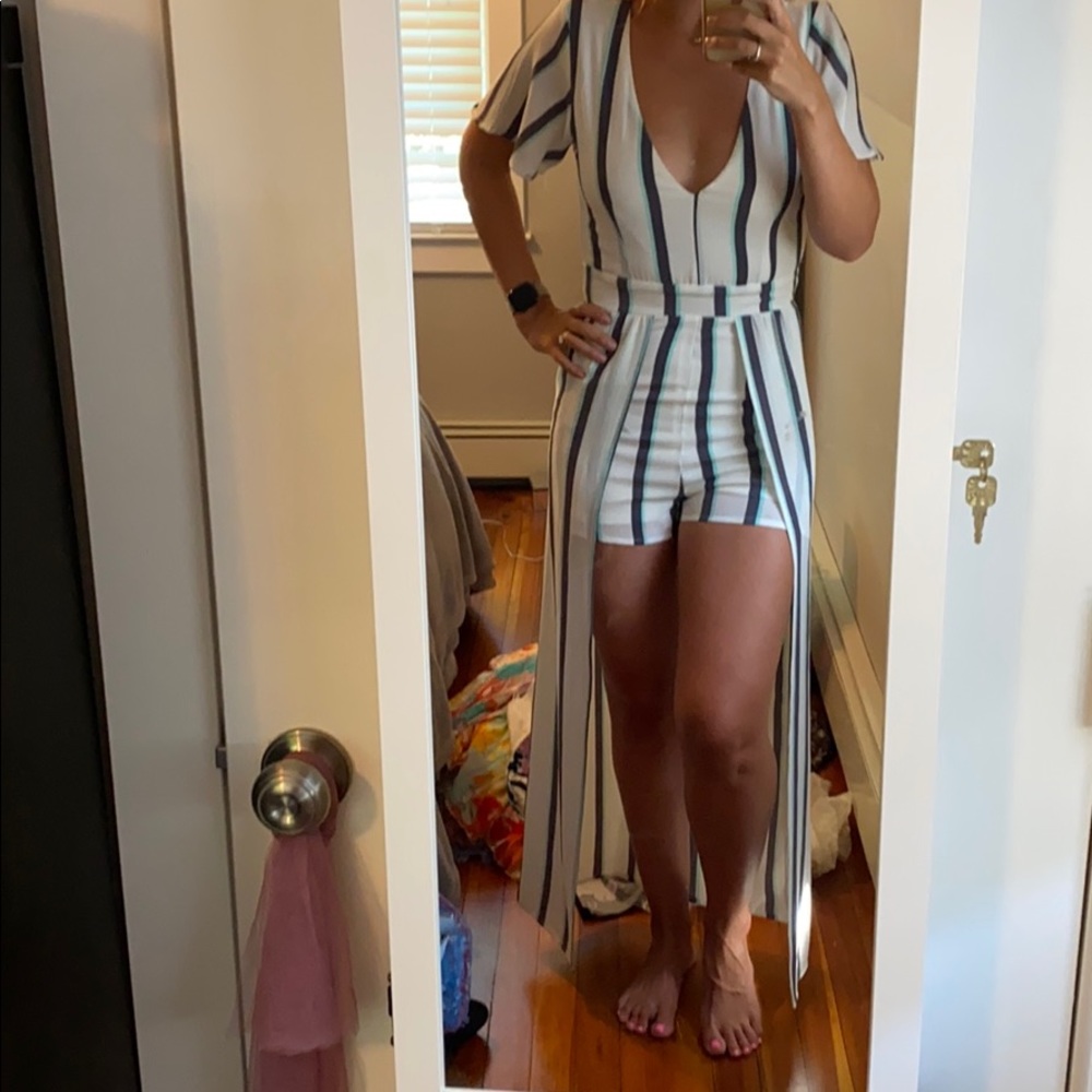 White jumpsuit with shorts underlay, skirt back